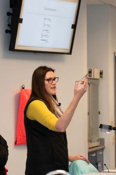 Dr. Richey highlights suturing techniques with the biomedical sciences students.