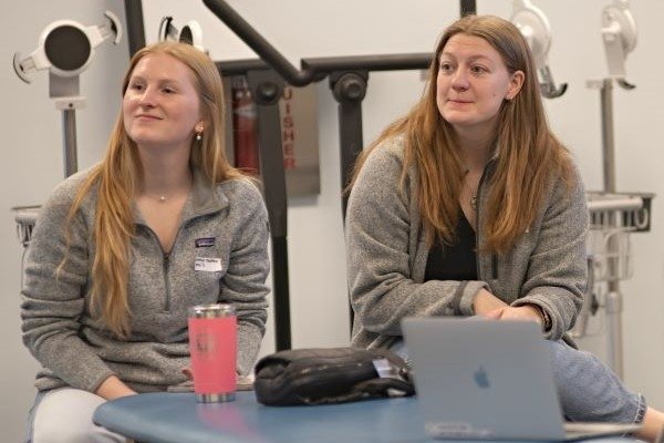 Pre-SOMA board directors Kathryn Pfeiffer (CCOM ’27) and Susan Westman (CCOM ’27) listen to the faculty panel.