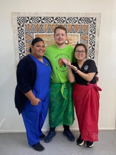 CDMA students pose with their Tupenu, given by a Tonga patient