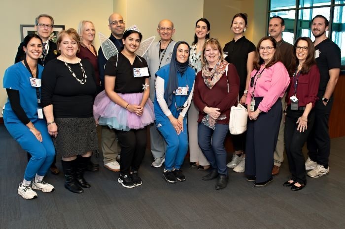 Group poses at Give Kids a Smile Event