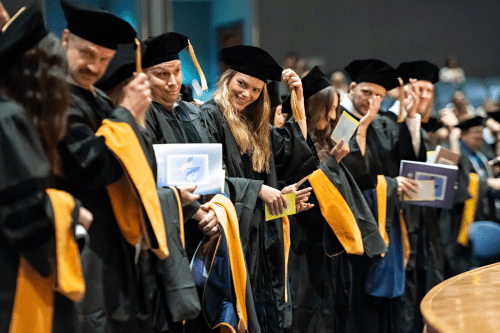 2025 College of Health Sciences, Glendale Campus graduates moving their tassels during commencement ceremonies