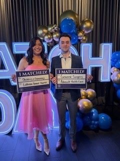 CCOM students hold up Match Day signs