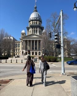 Two students walk to capitol building